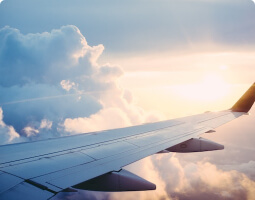 plane and sky and steams, sun shining